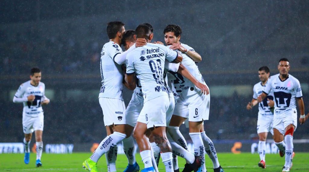 MEXICO CITY, MEXICO - OCTOBER 29: Nicolas Freire #18 of Pumas celebrate with teammates after scoring the third goal of his team during the 16th round match between Pumas UNAM and Atlas as part of the Torneo Apertura 2019 Liga MX at Olimpico Universitario Stadium on October 29, 2019 in Mexico City, Mexico. (Photo by Hector Vivas/Getty Images)