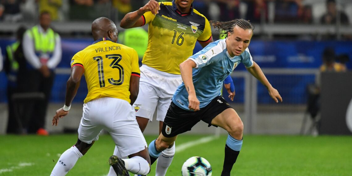 -- Uruguay's Diego Laxalt (R) is marked by Ecuador's Enner Valencia (L) during their Copa America football tournament group match at the Mineirao Stadium in Belo Horizonte, Brazil, on June 16, 2019. / AFP / Luis ACOSTA