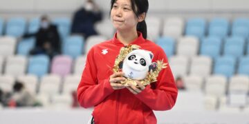 Silver medallist Japan's Miho Takagi celebrates during the flower ceremony for the women's speed skating 1500m event during the Beijing 2022 Winter Olympic Games at the National Speed Skating Oval in Beijing on February 7, 2022. (Photo by WANG Zhao / AFP)