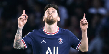 Paris Saint-Germain's Argentinian forward Lionel Messi (C) celebrates scoring his team's third goal during the UEFA Champions League first round group A football match between Paris Saint-Germain's (PSG) and RB Leipzig, at The Parc des Princes stadium, in Paris, on October 19, 2021. (Photo by FRANCK FIFE / AFP)