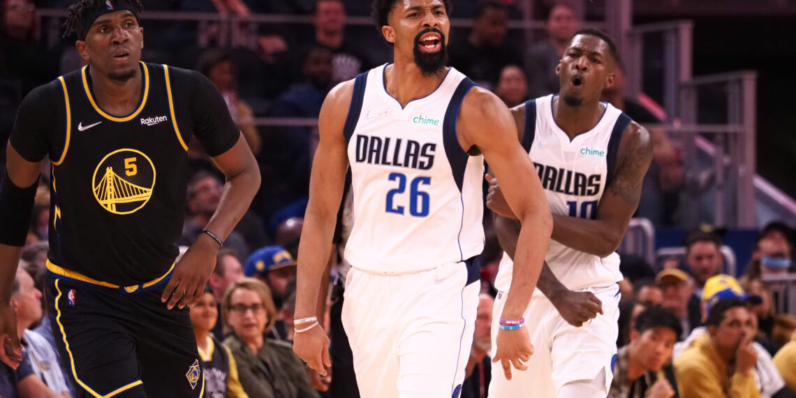 Feb 27, 2022; San Francisco, California, USA; Dallas Mavericks guard Spencer Dinwiddie (26) celebrates ahead of forward Dorian Finney-Smith (10) and Golden State Warriors forward Kevon Looney (5) after scoring a basket during the fourth quarter at Chase Center. Mandatory Credit: Kelley L Cox-USA TODAY Sports