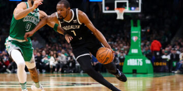 BOSTON, MA - MARCH 06  Kevin Durant #7 of the Brooklyn Nets drives to the basket past Jayson Tatum #0 of the Boston Celtics during a game at TD Garden on March 6, 2022 in Boston, Massachusetts. NOTE TO USER: User expressly acknowledges and agrees that, by downloading and or using this photograph, User is consenting to the terms and conditions of the Getty Images License Agreement. (Photo by Adam Glanzman/Getty Images)