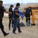 Trabajadores de servicios periciales y del equipo de Bomberos, rescatan hoy el cuerpo de una niña migrante en las orillas de rio bravo en Ciudad Juárez, Chihuahua (México). EFE/Luis Torres