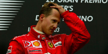 FILE PHOTO: ON THIS DAY Ð APRIL 20  April 20, 2003     FORMULA ONE - Ferrari's Michael Schumacher is overcome with emotion on the winners podium after claiming victory in the San Marino Grand Prix at Imola just hours after his mother Elisabeth, who was in a coma, died in Cologne.     Michael and his younger brother Ralf had flown by private jet to visit her on Saturday before returning for the race where both had qualified on the front of the grid.     While Ralf finished fourth in his Williams-BMW, Michael beat Kimi Raikkonen and team mate Rubens Barrichello to the chequered flag. None of the drivers sprayed champagne on the podium. REUTERS/Dylan Martinez/File Photo