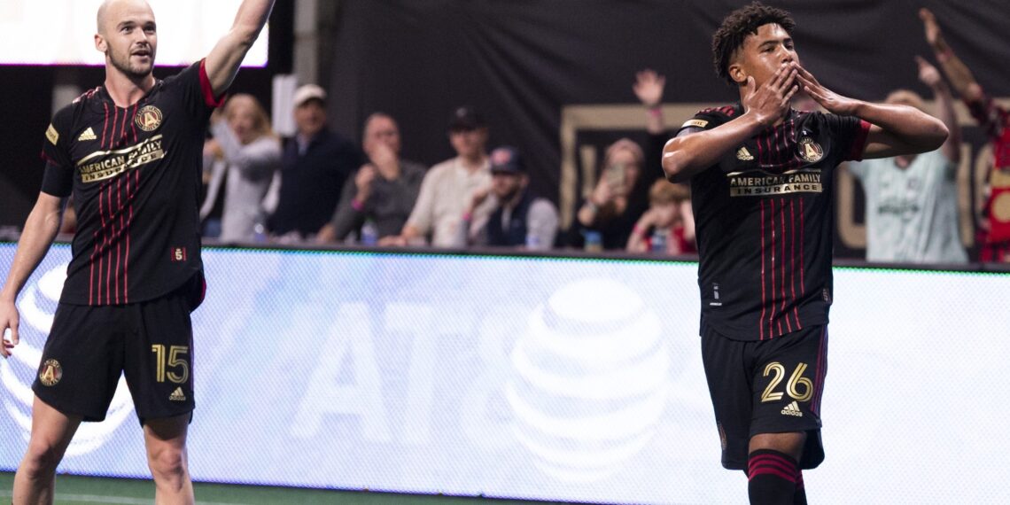 Atlanta United defender Caleb Wiley #26 celebrates after scoring a goal during the 2022 Opening Day match against Sporting Kansas City at Mercedes-Benz Stadium in Atlanta, United States on Sunday February 27, 2022. (Photo by Mitchell Martin/Atlanta United)
