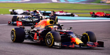 ABU DHABI, UNITED ARAB EMIRATES - DECEMBER 13: Max Verstappen of the Netherlands driving the (33) Aston Martin Red Bull Racing RB16 leads the field during the F1 Grand Prix of Abu Dhabi at Yas Marina Circuit on December 13, 2020 in Abu Dhabi, United Arab Emirates. (Photo by Giuseppe Cacace - Pool/Getty Images)