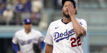 Los Angeles Dodgers starting pitcher Clayton Kershaw walks off the mound at the end of the the top of the 1st inning during Game 2 of a baseball NL Division Series, Wednesday, Oct. 12, 2022, in Los Angeles. (AP Photo/Mark J. Terrill)