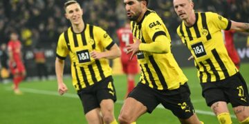 Dortmund's German midfielder Emre Can (C) celebrates scoring during the German first division Bundesliga football match between Borussia Dortmund and RB Leipzig in Dortmund on March 3, 2023. (Photo by INA FASSBENDER / AFP) / DFL REGULATIONS PROHIBIT ANY USE OF PHOTOGRAPHS AS IMAGE SEQUENCES AND/OR QUASI-VIDEO (Photo by INA FASSBENDER/AFP via Getty Images)