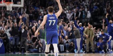 Dallas Mavericks guard Luka Doncic (77) gestures while walking up the court during the second half of the team's NBA basketball game against the Sacramento Kings in Dallas, Wednesday, April 5, 2023. (AP Photo/Sam Hodde)