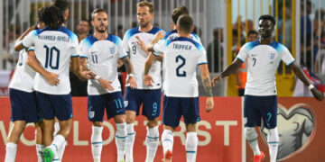 England's forward Harry Kane (C) celebrates with teammates after scoring a penalty during the UEFA Euro 2024 Group C qualifiers match between Malta and England on June 16, 2023 at the National Stadium Ta'Qali in Attard, Malta. (Photo by Matthew MIRABELLI / AFP)