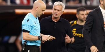 BUDAPEST, HUNGARY - MAY 31: Referee Anthony Taylor looks on with Jose Mourinho, Head Coach of AS Roma, during the UEFA Europa League 2022/23 final match between Sevilla FC and AS Roma at Puskas Arena on May 31, 2023 in Budapest, Hungary. (Photo by Naomi Baker/Getty Images)