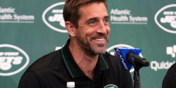 Apr 26, 2023; Florham Park, NJ, USA; New York Jets quarterback Aaron Rodgers (8) talks to the media during the introductory press conference at Atlantic Health Jets Training Center. Mandatory Credit: Tom Horak-USA TODAY Sports