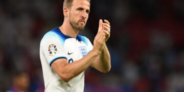 England's striker Harry Kane applauds fans on the pitch after the UEFA Euro 2024 group C qualification football match between England and North Macedonia at Old Trafford in Manchester, north west England, on June 19, 2023. England won the game 7-0. (Photo by Oli SCARFF / AFP) / NOT FOR MARKETING OR ADVERTISING USE / RESTRICTED TO EDITORIAL USE (Photo by OLI SCARFF/AFP via Getty Images)