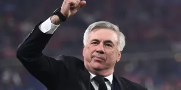 (FILES) Real Madrid's Italian coach Carlo Ancelotti gestures as he celebrates his team's victory during the UEFA Champions League final football match between Liverpool and Real Madrid at the Stade de France in Saint-Denis, north of Paris, on May 28, 2022. Italian Carlo Ancelotti will be the coach of Brazil from the Copa America 2024, which will be played in June-July in the United States, once his contract with Real Madrid ends, a source from the Brazilian Football Confederation (CBF) told AFP on July 4, 2023. The entity confirmed minutes that Brazilian Fernando Diniz, from Fluminense of Rio de Janeiro, will lead the five-time champions for a year, until 'Carletto' takes over as coach. (Photo by Anne-Christine POUJOULAT / AFP)