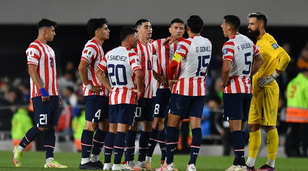 BUENOS AIRES, ARGENTINA - OCTOBER 12: Miguel Almiron of Paraguay (C) talks to teammates at the end of the first half during the FIFA World Cup 2026 Qualifier match between Argentina and Paraguay at Estadio Más Monumental Antonio Vespucio Liberti on October 12, 2023 in Buenos Aires, Argentina. (Photo by Marcelo Endelli/Getty Images)