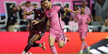 Apr 6, 2024; Fort Lauderdale, Florida, USA; Inter Miami CF forward Lionel Messi (10) moves the ball against Colorado Rapids forward Kimani Stewart-Baynes (27) during the second half at Chase Stadium. Mandatory Credit: Nathan Ray Seebeck-USA TODAY Sports